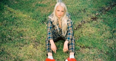 Savannah Conley sitting on grass