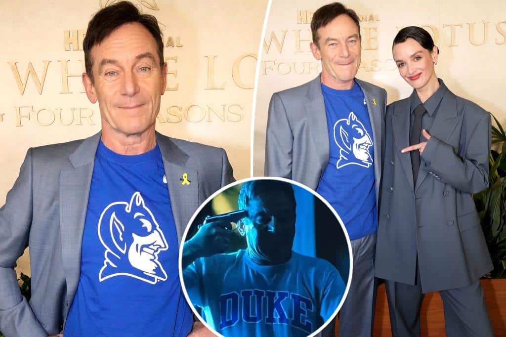‘White Lotus’ star Jason Isaac sticks it to Duke with Blue Devil T-shirt after university complained over graphic scene