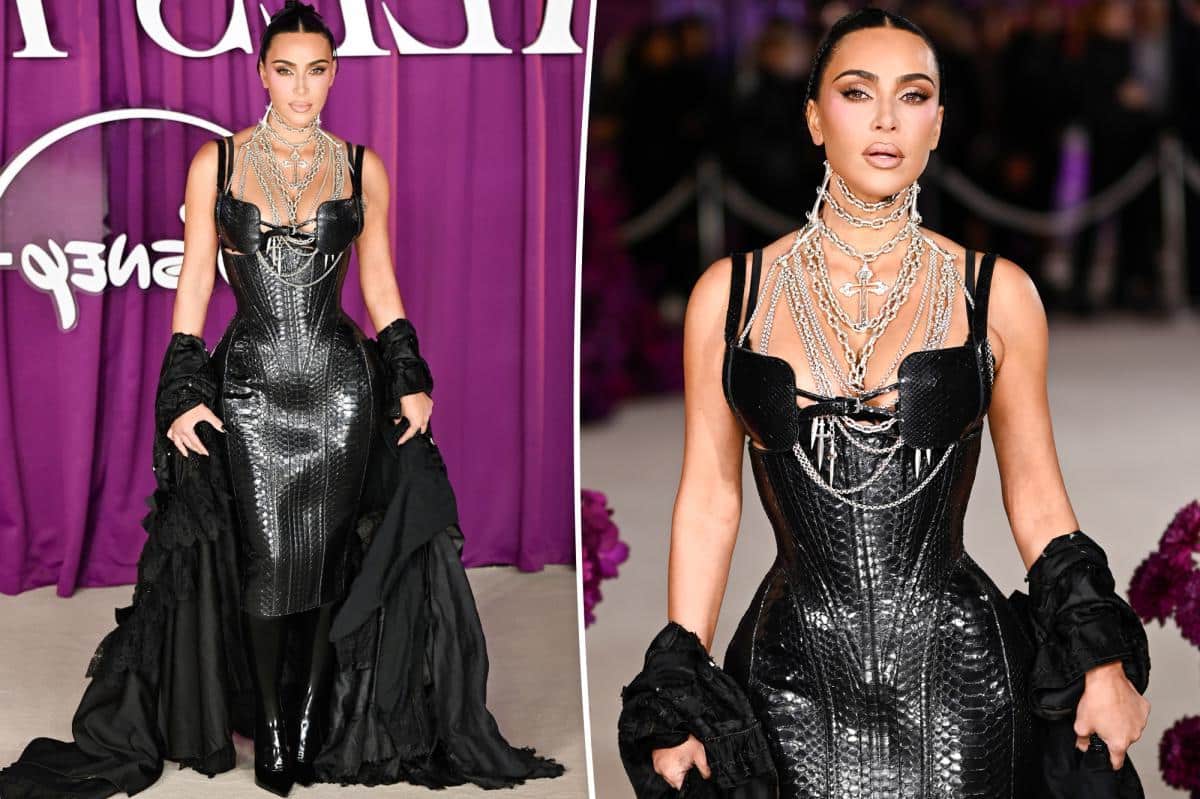 Kim Kardashian smolders in black leather corset dress and layers of chains at ‘All’s Fair’ London premiere