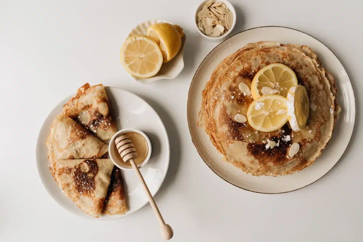 Almond powder, whole flour, and maple syrup ingredients measured out for crumble topping