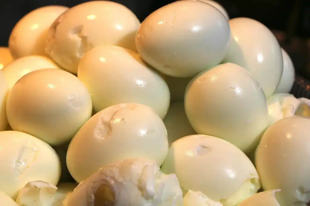 Hard-boiled eggs and fresh ingredients ready to blend for oil-free mayonnaise