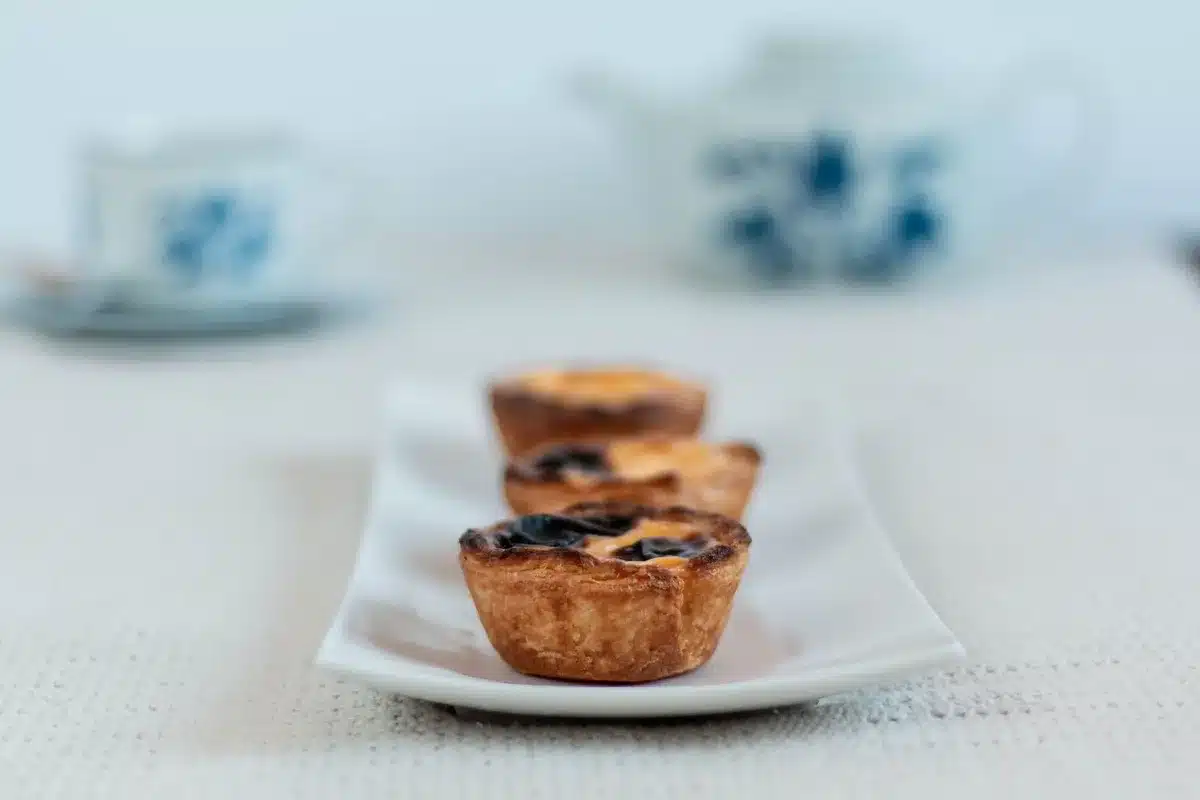 Creamy egg-free flan dessert with smooth texture in a mold, surrounded by plant-based ingredients