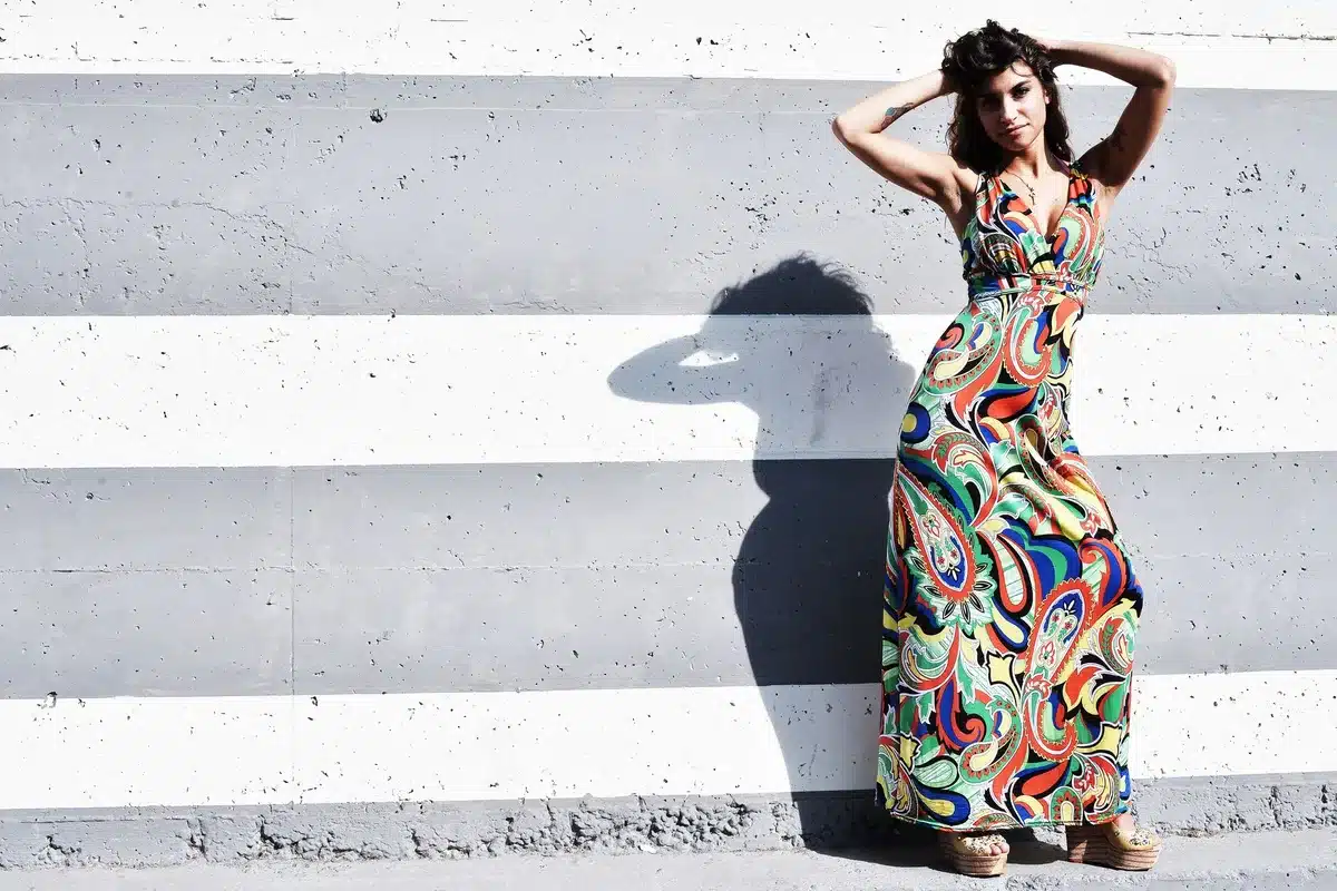 Luxurious Japanese double-faced satin halter maxi dress with draped neckline and open back detail.