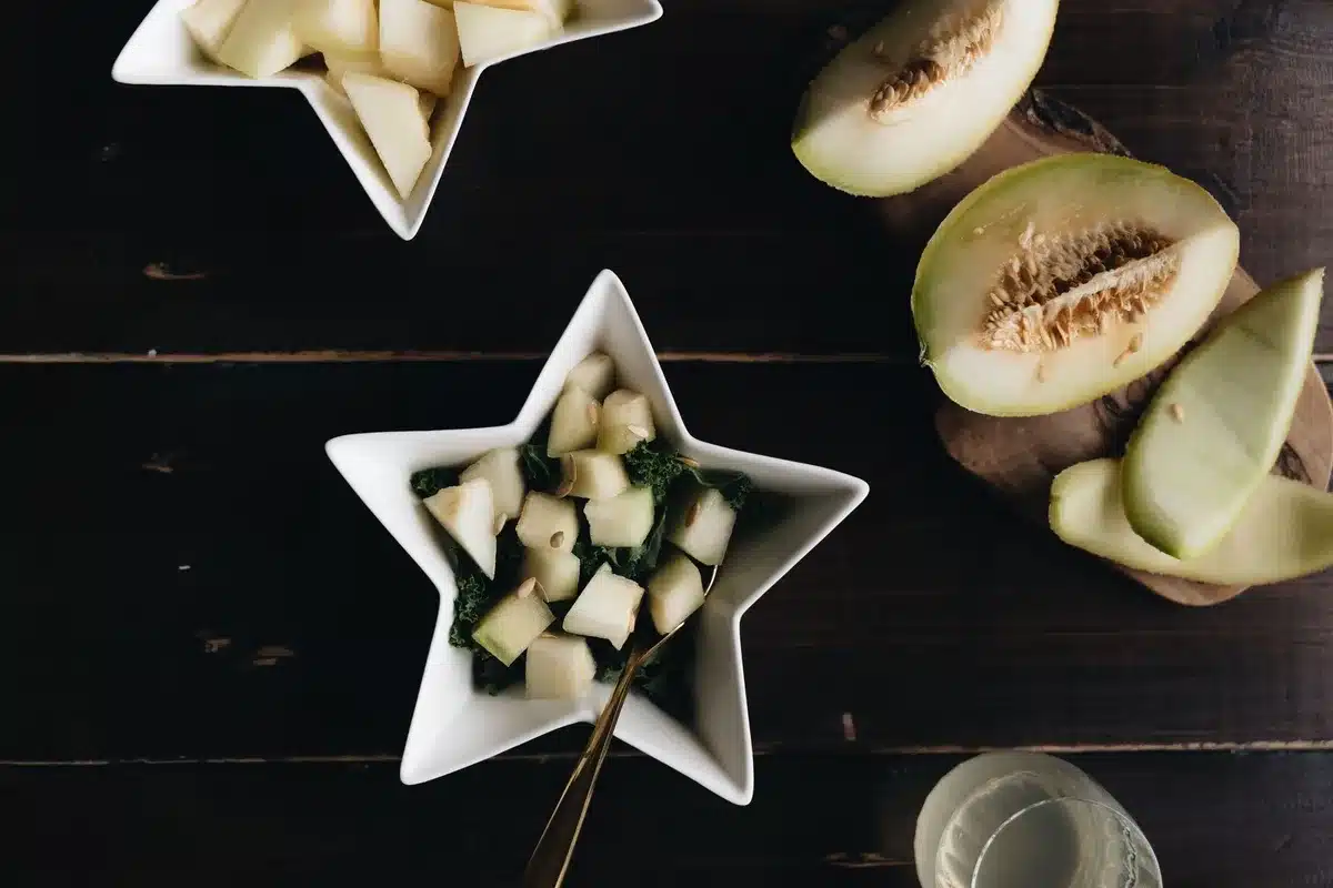 Fresh melon wedges and slices arranged as a summer appetizer.