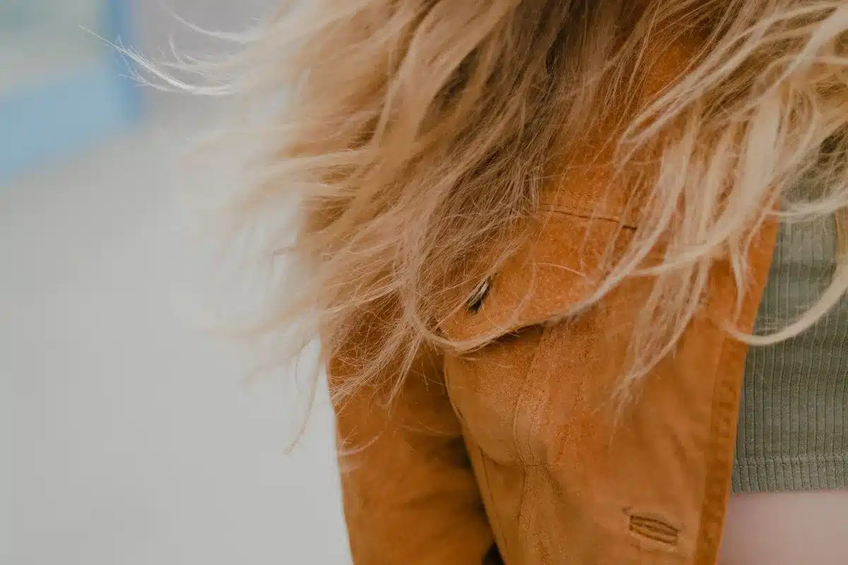 Woman with layered, wavy hair showing movement and texture