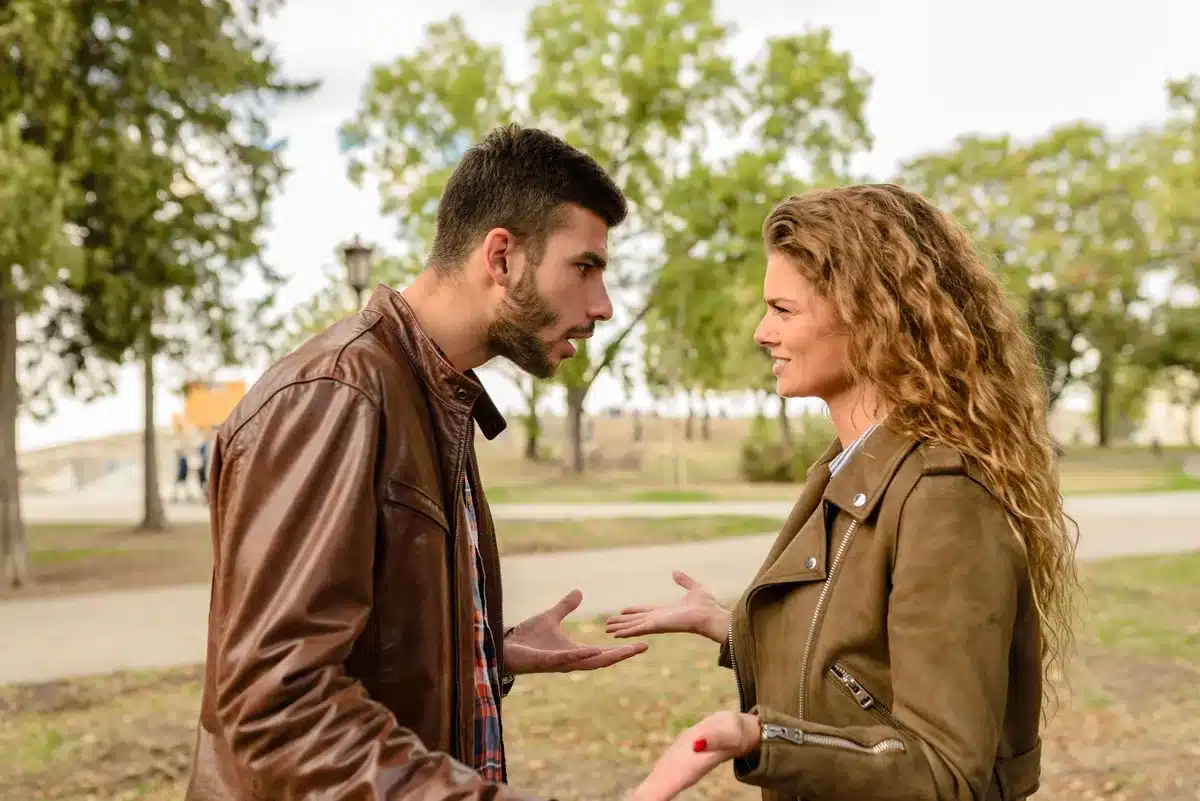 Two people having a serious conversation, working through differences together.