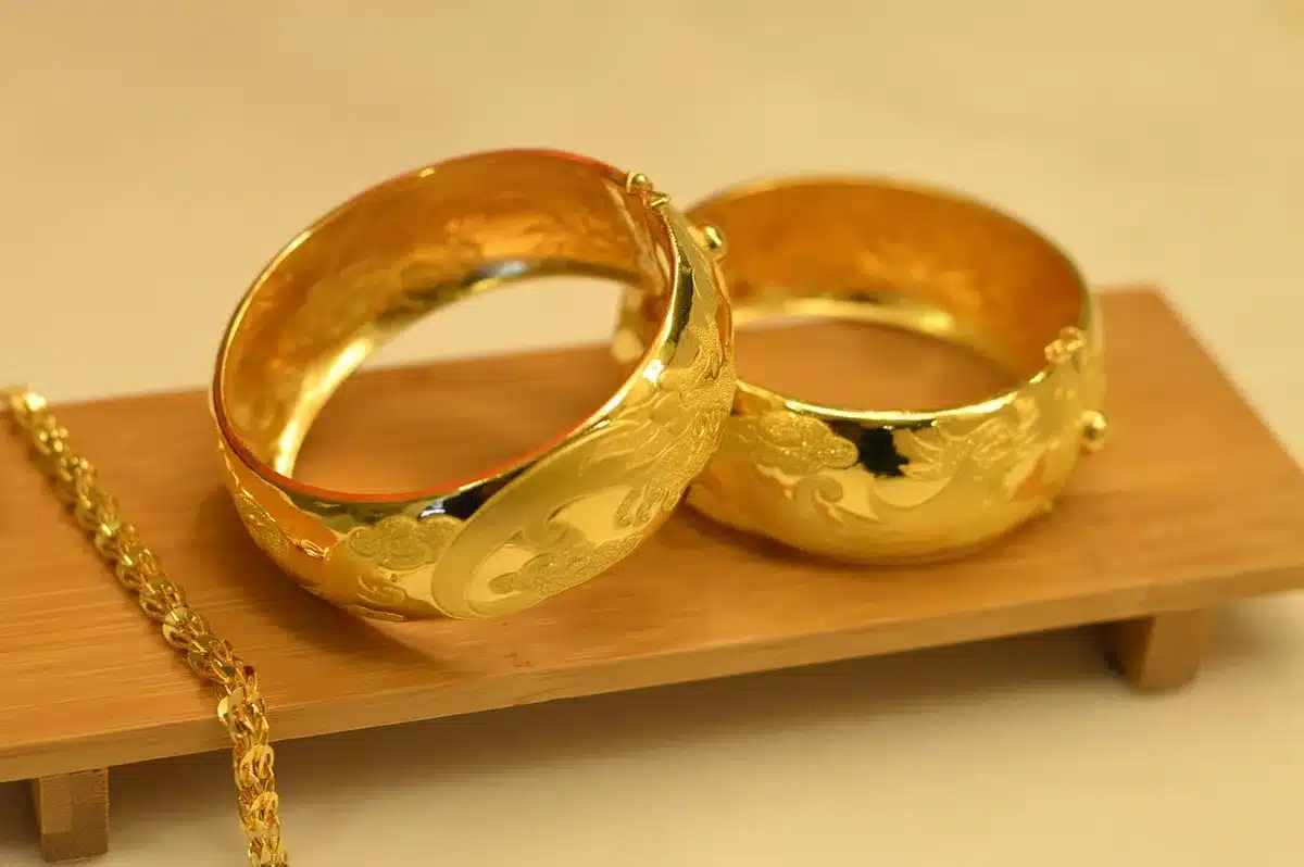 Luxury jewelry including opal bracelet and ring set displayed on elegant surface