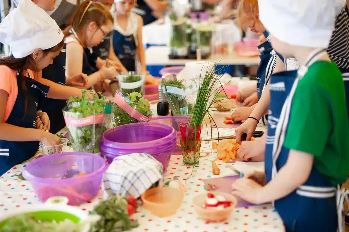 Chef plating a dish during a live cooking demonstration