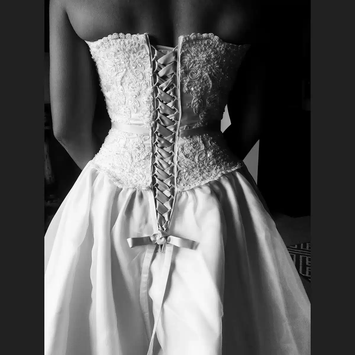 Close-up of a strapless sweetheart corset gown bodice with beadwork