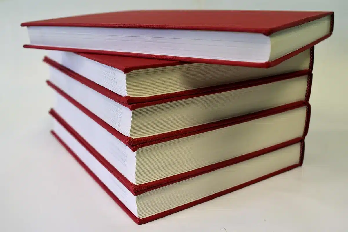 Close-up of a memoir book on a table with a pair of reading glasses