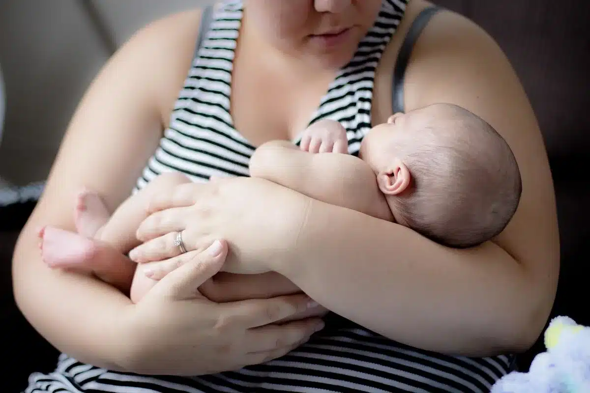 Toddler in the middle of a tantrum while a caregiver remains calm