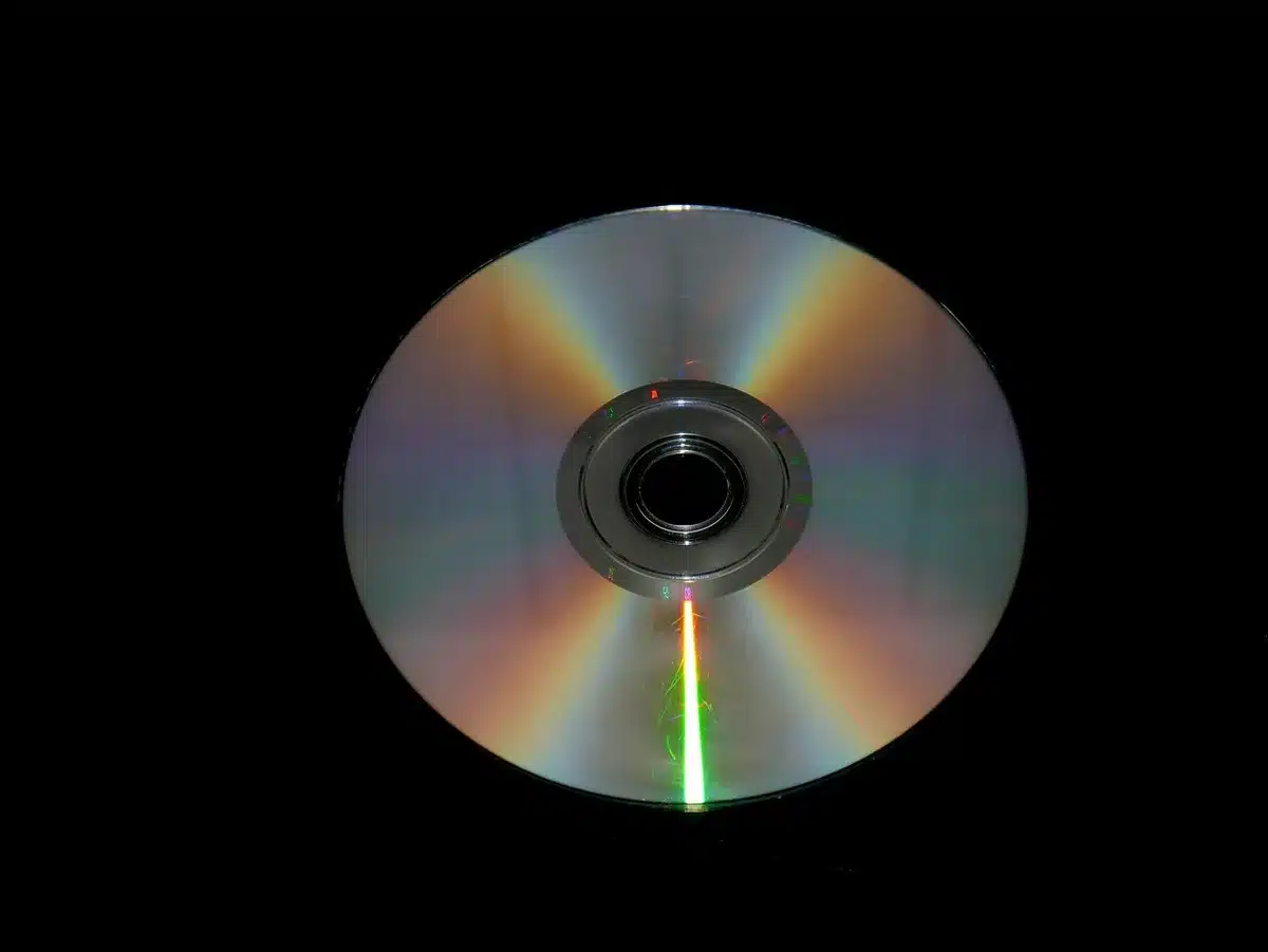 Stack of Blu-ray and DVD discs and cases on a shelf